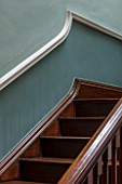 MORTON HALL, WORCESTERSHIRE: DETAIL OF WOODEN STAIRCASE IN HALLWAY PAINTED FB GREEN-BLUE (ABOVE DADO) AND OVAL ROOM BLUE (BELOW DADO)