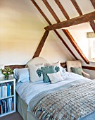 THE COACH HOUSE,SURREY: POLLYS BEDROOM WITH BLANKET FROM NEPTUNE, CUSHIONS BY HUDSON HOMES & INTERIORS. NEUTRAL DECOR, OAK BEAMS, ORIGINAL FEATURES