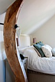 THE COACH HOUSE,SURREY: GUEST BEDROOM WITH DETAIL OF OAK BEAM SUPPORT WITH HANGING HEART. NEUTRAL DECOR, FRENCH COUNTRY STYLE.