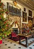 BURTON AGNES HALL, EAST YORKSHIRE: CHRISTMAS  - GREAT HALL, CHRISTMAS TREE, BOUGHS AND BRANCHES FROM THE ESTATE. ORNAMENT