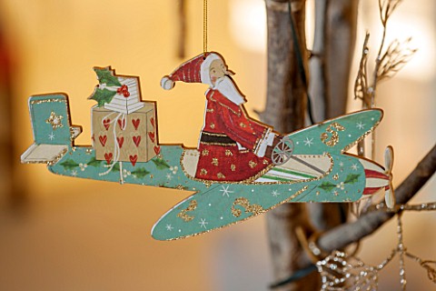 BURTON_AGNES_HALL_EAST_YORKSHIRE_CHRISTMAS__THE_GARDEN_GALLERY__WOODEN_AEROPLANE_CUT_OUT_DECORATION_