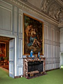 VAUX LE VICOMTE, FRANCE: THE KINGS FORMER STUDY AT CHRISTMAS. GREY PANELLED WALLS AND MARBLE FIREPLACE