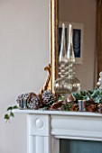 THE FREETH, HEREFORDSHIRE: THE SITTING ROOM. MIRROR, PINE CONES, GLASS, CHRISTMAS, MANTELPIECE