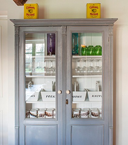 THE_FREETH_HEREFORDSHIRE_KITCHEN_DINER_BLUE_GLASS_CUPBOARD_WITH_COLEMANS_MUSTARD_TINS