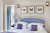 THE FREETH, HEREFORDSHIRE: LILAC BEDROOM - BED, CUSHIONS, BUTTERFLY PRINTS, THROW, PRESENTS, CHRISTMAS, BEDSIDE LAMP
