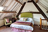 THE FREETH, HEREFORDSHIRE: DOUBLE BEDROOM - BED, HEADBOARD IN GREEN LINEN, WICKER CHAIR
