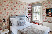 LONDON HOUSE DESIGNED BY JULIE SIMONSEN. GUEST BEDROOM WITH PAINTING OF YOUNG GIRL FOUND AT PARISIAN ANTIQUES DEALER. JULIE DECORATED THE WHOLE ROOM AROUND HER. QUILTED ANTIQUE WELSH COVERLET.