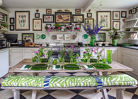 BUTTER_WAKEFIELD_HOUSE_LONDON_THE_KITCHEN__TABLE_SET_WITH_GREEN_PLATES_AND_FLOWERS_FROM_THE_GARDEN_I