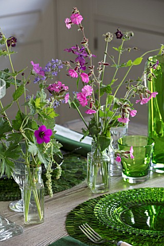 BUTTER_WAKEFIELD_HOUSE_LONDON_THE_KITCHEN__GLASS_JARS_WITH_FLOWERS_CUT_FROM_THE_GARDEN__GERANIUMS_AN