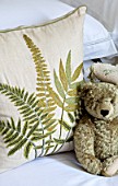BUTTER WAKEFIELD HOUSE, LONDON: ZOES BEDROOM: TEDDY BEAR AND FERN CUSHION