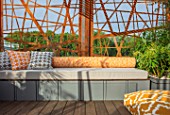 CHELSEA FLOWER SHOW 2017: CITY LIVING GARDEN DESIGNED BY KATE GOULD. MODERN, CONTEMPORARY, METAL, SCREEN, SCREENING, ORANGE, SEAT, SEATING, DECK, DECKING, CUSHIONS, RELAXING