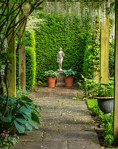 COTTAGE_ROW_DORSET_PATH_WOODEN_PERGOLA_HOSTAS_IN_CONTAINERS_STATUE_FORMAL_ENGLISH_CLASSIC_GARDEN_FRA