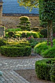THE OLD RECTORY, QUINTON, NORTHAMPTONSHIRE: DESIGNER ANOUSHKA FEILER: FRONT GARDEN - CLIPPED TOPIARY CLOUD PRUNED CARPINUS BETULUS IN CONTAINERS, HORNBEAM, FOLIAGE, GREEN