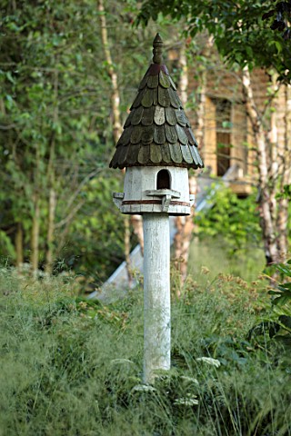 THE_OLD_RECTORY_QUINTON_NORTHAMPTONSHIRE_DESIGNER_ANOUSHKA_FEILER_WOODEN_BIRD_HOUSE_IN_THE_WOODLAND_