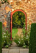 PARHAM, SUSSEX: GATE IN THE WALLED GARDEN WITH COSMOS PURITY FLOWERS. COUNTRY, ENGLISH, FRAME, VIEW THROUGH, WHITE, FLOWERS