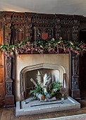 BADDESLEY CLINTON, WARWICKSHIRE: THE NATIONAL TRUST- CHRISTMAS, 15TH AND 16TH CENTURY MOATED MANOR HOUSE. DINING ROOM, FIRE, MANTELPIECE