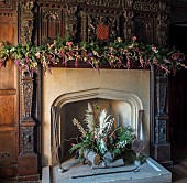 BADDESLEY CLINTON, WARWICKSHIRE: THE NATIONAL TRUST- CHRISTMAS, 15TH AND 16TH CENTURY MOATED MANOR HOUSE. DINING ROOM, FIRE, MANTELPIECE