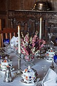 BADDESLEY CLINTON, WARWICKSHIRE: THE NATIONAL TRUST- CHRISTMAS, 15TH AND 16TH CENTURY MOATED MANOR HOUSE. DINING ROOM, TABLE WITH CHINA, SILVERWARE, DRIED FLOWERS IN VASE