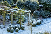 MORTON HALL GARDENS, WORCESTERSHIRE: VIEW DOWN ONTO SOUTH GARDEN. PERGOLA, ARBOUR, NOVEMBER, FROST, COLD, TOPIARY, CLIPPED, ENGLISH, COUNTRY, GARDEN