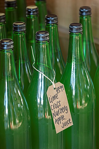 LIME_CROSS_NURSERY_EAST_SUSSEX_WINTER_JANUARY_BOTTLES_OF_LIME_CROSS_APPLE_JUICE_FOR_SALE_AT_THE_NURS