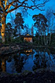MORTON HALL, WORCESTERSHIRE: NIGHT TIME, LIGHTS, LIGHTING, EVENING, WATER, GARDEN, COUNTRY, HOUSE, TREES, POND, POOL, REFLECTIONS, REFLECTED, JAPANESE TEA HOUSE