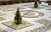 ABERGLASNEY GARDENS, CAMARTHENSHIRE, WALES. CLOISTER GARDEN IN SNOW. FEBRUARY, KNOT, KNOTS, PARTERRE, GRASS, FORMAL, PATTERN, PATTERNS, LAWN, PATHS, TOPIARY, CLIPPED, YEW, TAXUS