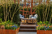 ASCOT SPRING GARDEN SHOW: GARDEN DESIGNED BY KATE GOULD: CORTEN STEEL SCREEN, BAMBOO DECK, SUSTAINABLE, SMALL, FORMAL, URBAN, TOWN, HEDGES, HEDGING, SEATING, ZERO CIRCULAR FIRE PIT