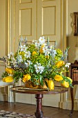 PARHAM HOUSE AND GARDENS, SUSSEX: FLOWER ARRANGEMENT WITH TULIPA  MRS JOHN T SCHEEPERS, VARIEGATED EUONYMUS, CAMASSIA, NARCISSUS POETICUS VAR. RECURVUS. SPRING, CUTTING