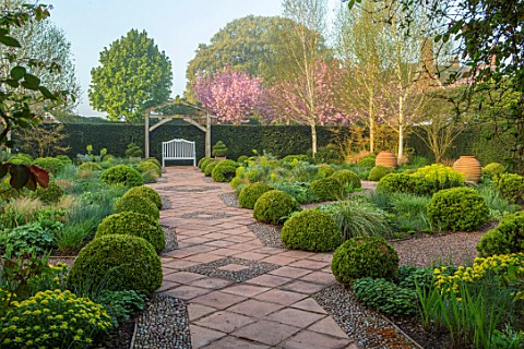 MITTON_MANOR_STAFFORDSHIRE_PATH_SEATING_CLIPPED_TOPIARY_BOX_BUXUS_SPRING_HEDGES_SYMMETRY_FORMAL_ENGL