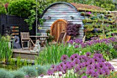 THE MOONGATE GARDEN, SUSSEX: ALLIUM FIRMAMENT, HOBBIT HOUSE, SUMMERHOUSE, SUMMER HOUSE, OUTSIDE ROOM, SHED, DEN, OFFICE, TABLE, CHAIRS, WOODEN, LIVING ROOF, POOL, POND