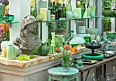 CLAUS DALBY GARDEN, DENMARK: GREENHOUSE, STUDIO - STATUE, EMPTY CONTAINERS FOR FLOWER ARRANGING IN GREEN