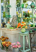 CLAUS DALBY GARDEN, DENMARK: GREENHOUSE, STUDIO - STATUE, EMPTY CONTAINERS FOR FLOWER ARRANGING IN GREEN. TULIPS CAIRO, PEACH BLOSSOM, SENSUAL TOUCH, BROWN SUGAR