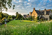 ASTHALL MANOR, OXFORDSHIRE: LAWN WITH SCULPTURE, CHURCH, ENGLISH, COUNTRY, GARDEN