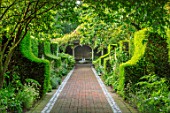 WORMSLEY, BUCKINGHAMSHIRE: FLINT AND BRICK PATH, WALLED GARDEN, SUMMERHOUSE, SUMMER HOUSE - BORDER WITH PERENNIALS, SUMMER, ENGLISH, COUNTRY, WALLS, WALLED, YEW HEDGES, HEDGING