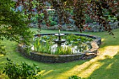 TOWN PLACE GARDEN, SUSSEX: LAWN, CIRCULAR POOL, FOUNTAIN, WATER, POND, RAISED, SUMMER
