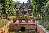HAMPTON COURT CASTLE, HEREFORDSHIRE: PAVILION IN THE SOUTH GARDEN: BOX HEDGES, HEDGING, LAVENDER, BUILDINGS, SUMMERHOUSES, STRUCTURES, WATER, CANAL