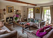 PYTTS HOUSE, OXFORDSHIRE: SITTING ROOM, SOFAS, CUSHIONS, FIREPLACE