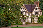 PASHLEY MANOR GARDEN, SUSSEX: THE HOUSE AND MAIN DRIVE IN AUTUMN