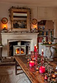 PYTTS HOUSE, OXFORDSHIRE: LIVING ROOM WITH FIREPLACE, CHRISTMAS, CANDLES, TABLE, MIRROR, WINTER