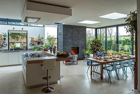 GIBBONS_CROFT_WEST_CLANDON_SURREY_OPEN_PLAN_KITCHEN_DINING_ROOM_SLATE_WALL_FIREPLACE_KITCHEN_ISLAND_