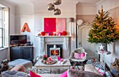 AMANDA KNOX HOUSE GRANTHAM: FRONT LIVING ROOM, FIREPLACE, MODERN ABSTRACT PAINTING, CHRISTMAS TREE, TABLE