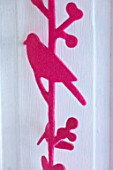 AMANDA KNOX HOUSE GRANTHAM: WHITE AND PINK KITCHEN, CHRISTMAS: PINK BIRD DECORATION ON FRENCH SHUTTERS SCREENING UTILITY ROOM