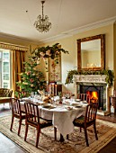 MARBURY HALL, SHROPSHIRE: DESIGNER SOFIE PATON-SMITH - DINING ROOM, VICTORIAN INSPIRED CHRISTMAS, FIREPLACE, TABLE, CHAIRS, DECEMBER