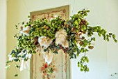 MARBURY HALL, SHROPSHIRE: DESIGNER SOFIE PATON-SMITH - DINING ROOM, VICTORIAN INSPIRED CHRISTMAS, CLOUD DECORATION HANGING FROM CEILING - HOPS, PAMPAS GRASS, HONESTY, EUCALYPTUS