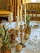 MARBURY HALL, SHROPSHIRE: DESIGNER SOFIE PATON-SMITH - VICTORIAN CHRISTMAS, TABLE, DECORATION, CANDLES, PINEAPPLES