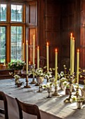 WARDINGTON MANOR, OXFORDSHIRE: FLORIST SHANE CONNOLLY - DINING ROOM: DINING TABLE, WHITE TABLECLOTH, CANDLES, SILVER VASES WITH CHRISTMAS ROSE, HELLEBORES, INDOOR, FLOWERS