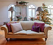 MERRYWOOD, JACKY HOBBS HOUSE, LONDON: CHRISTMAS, SITTING ROOM, CHRISTMAS TREE, SLEDGE, SOFA, LAMPS, CUSHIONS