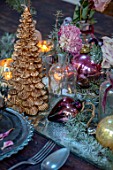MERRYWOOD, JACKY HOBBS HOUSE, LONDON: SITTING ROOM - DINING AREA, WOODEN DINING TABLE, CANDLES, GOLD CHRISTMAS TREE, PLACE SETTINGS, DRIED ROSES