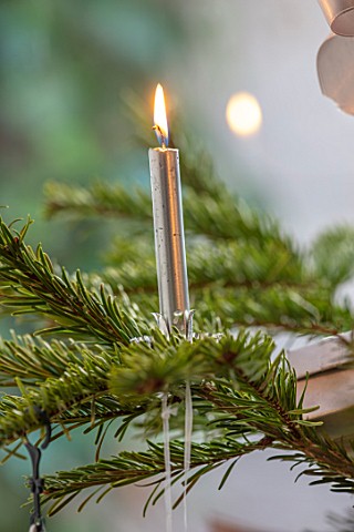 MERRYWOOD_JACKY_HOBBS_HOUSE_LONDON_CHRISTMAS_TREE_DETAIL_WITH_SILVER_CANDLE_AND_FLAME