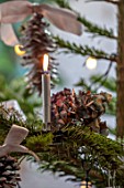MERRYWOOD, JACKY HOBBS HOUSE, LONDON: CHRISTMAS TREE DETAIL, NATURAL DECORATION, DRIED HYDRANGEA, SILVER CANDLE, PINE CONE